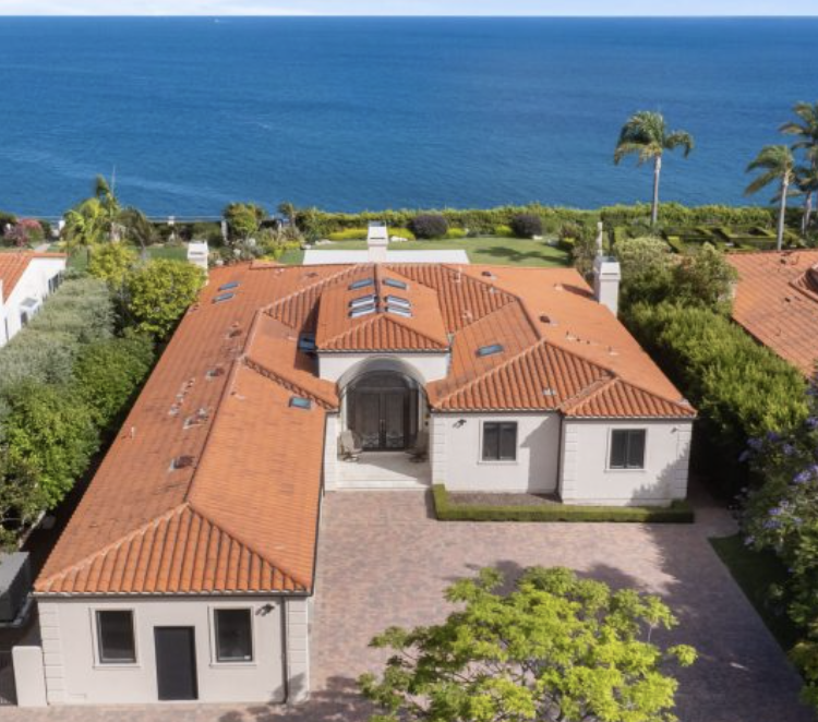 Aerial view of a clay tile roof on a coastal Mediterranean-style home